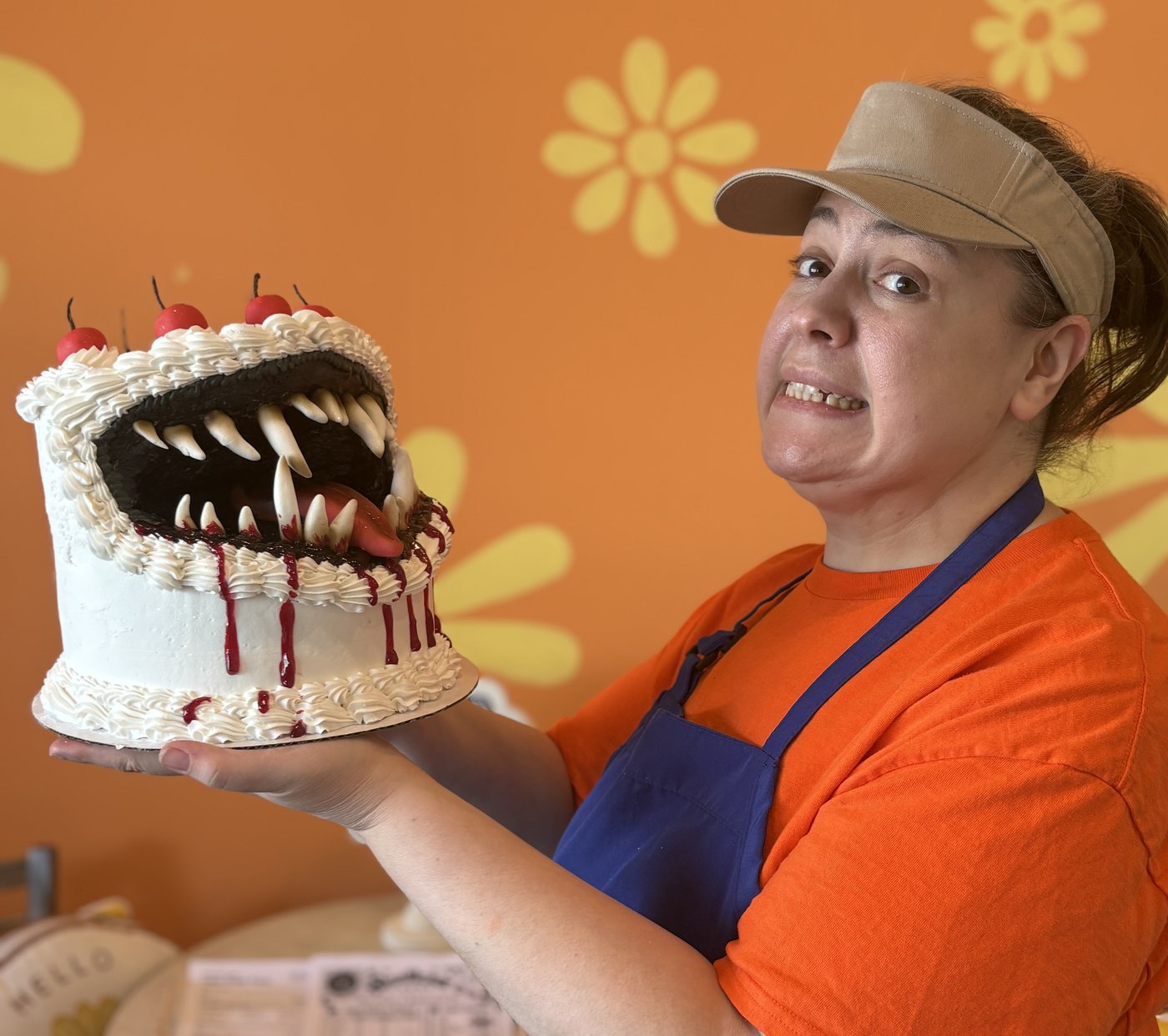 Mindy holding one of her showstopper cakes