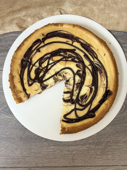 Chocolate marble cheesecake with ganache drizzle
