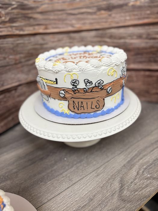 Hand-drawn tool belt birthday cake with a bag of nails